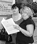 L-R: Pictured here are Margaret English and Maura McKeever, daughters of the murdered victims of the loyalist car bombing at the Kay's Tavern bar in Dundalk, 19 December 1975. Maura holds a copy of the Barron Report into this and other atrocities during the 1970s.