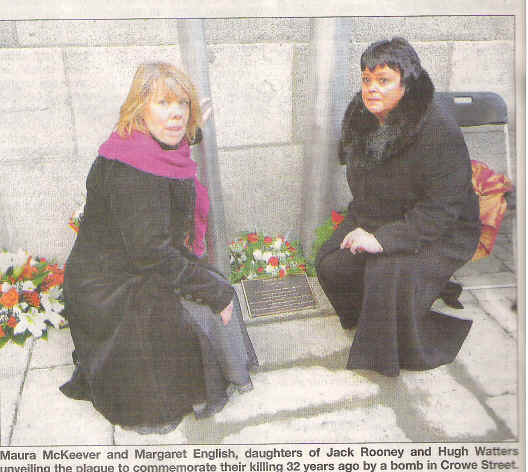 Maura McKeever, daughter of murder victim Jack Rooney,  is at left in this photograph of the recent unveiling of a memorial to the victims of the Dundalk bombing. At right is Margaret Enlish, daughter of the murdered Hugh Watters. Photograph from The Dundalk Democrat, 26 December 2007.