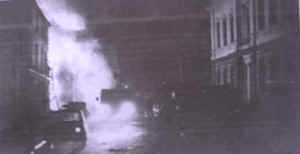 A photograph taken soon after the car bomb attack on the night of 19 December 1975 showing the emergency services at work. Photo: Paul Kavanagh, From The Argus, 12 July 2006.