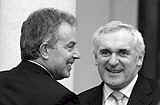 Pictured here are Britain's  PM Tony Blair and Bertie Ahern. Mr Ahern has been urged to hold talks with Blair about British state collusion with loyalists in attacks on both sides of the border, including the Dundalk bombing.