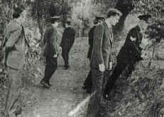 Gardai searching the lane where Seamus Ludlow's body was found. In civilian clothes at right is John Courtney, one of two detectives who received a file from the RUC in 1979, naming four loyalist suspects for this killing.